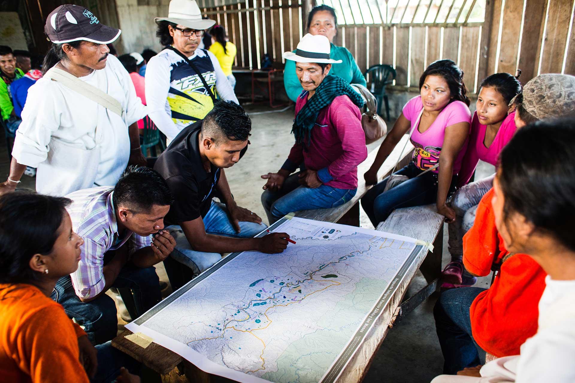 Members of indigenous community in Caqueta, Colombia work on a community map