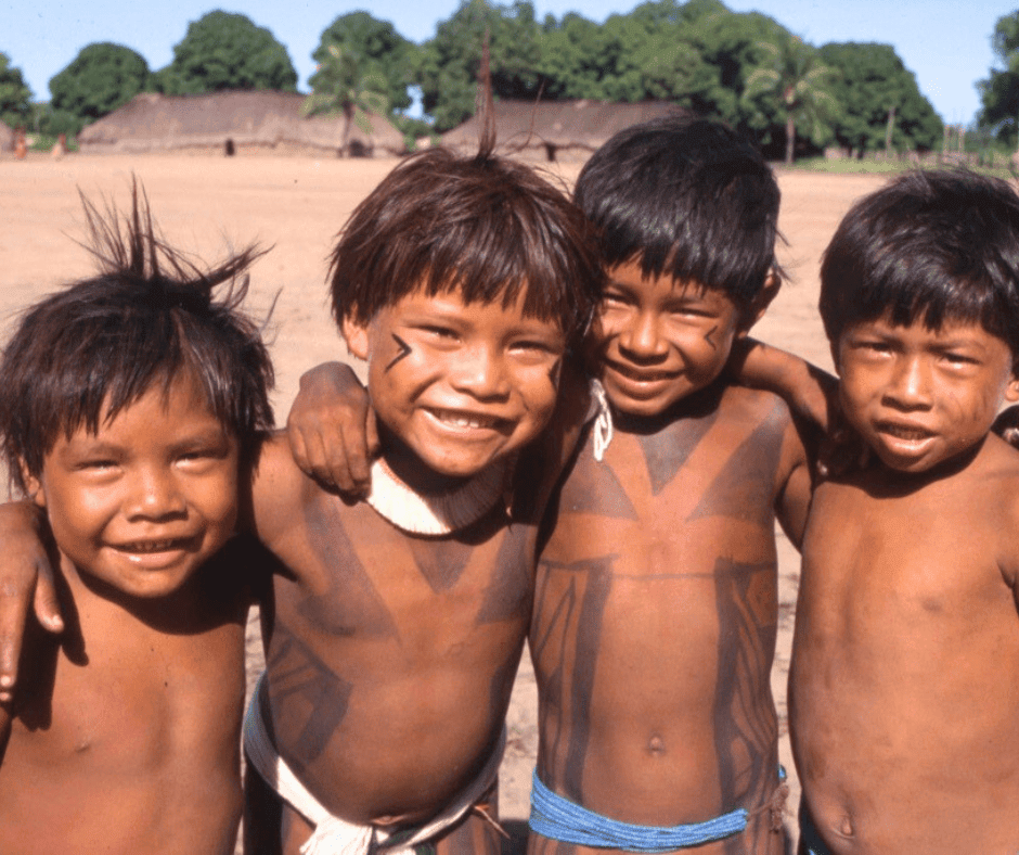 Indigenous boys outside the maloka in Xingu